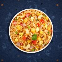 Pineapple Fried Rice · Fried rice with pineapple, onion, cashew nut, and fried egg.
