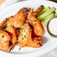 Chicken Wings · 1 and 1/2 lbs of wings, chili- lime hot sauce, celery and ranch.