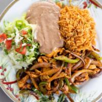 Fajitas Plate · Grilled peppers and onion, refried beans, rice, lettuce, pico de gallo, and choice of protein.