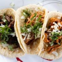 Classic Taco · Corn tortilla with choice of protein, onions, and cilantro.