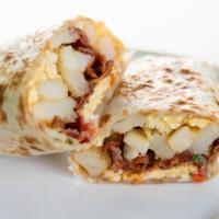 Spanish Breakfast Burrito · Flour tortilla with refried beans, rice, egg, potatoes, sour cream, cheese, pico de gallo, a...