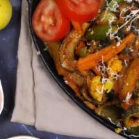 Veggie Tawa Fry · VEGGIE  SAUTEE WITH ONIONS, BROCCOLI, CABBABE, CARROTS AND CHEF'S SECRET RECIPES.