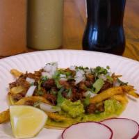 2 X Senor Taco · Fresh Corn Tortilla with Skinny Fries, Choice of Meat, Guacamole, Garnished with Onion and C...