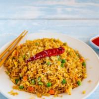 Spicy Thai Fried Rice · Basil, red pepper, jalapeños, chilies, garlic, egg and onions