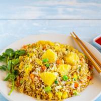 Pineapple Fried Rice · Fried rice cooked with eggs, curry, pineapple and onions.