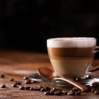 Cappuccino · A cappuccino is the perfect balance of espresso, steamed milk, and foam.