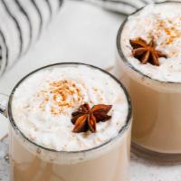 Chai Latte · Made by mixing steamed milk with black tea infused with spices topped with cinnamon powder.