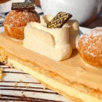 St Honore · Caramelized puff pastry, hazelnut cream, chantilly cream, and cream puffs.
