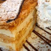 Napoleon · Layers of caramelized puff pastry filled with vanilla cream.
