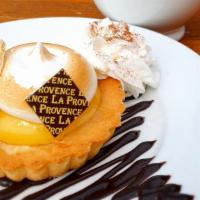 Lemon Tart · Luscious lemon pastry cream and toasted meringue in a tart shell, finished with lemon bark.