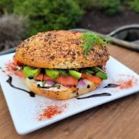 Smoked Salmon Bagel · Smoked bacon, Avocado, green onions, and cream cheese, served on a bagel.