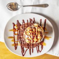 Truly A'Mazon Fudge Brownie  · A sinful warm brownie covered in chocolate and caramel sauces with a scoop of rich vanilla b...