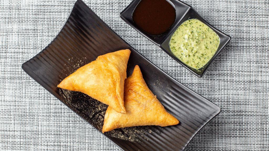Vegetable Samosa  · A pastry of Vedic origin filled with spiced potatoes & onions.