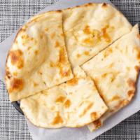 Cheese Naan · Naan bread garnished with cheese and spices.