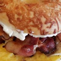 Bagel Breakfast Sandwich · Toasted plain bagel, cream cheese, egg, and your choice of either sausage, bacon or turkey.