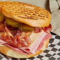 Cuban · Bacon, Ham, Salami, Swiss Cheese, Pickles, Mayo & Mustard Pressed On A Pub Bun.