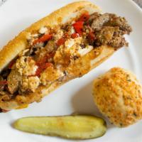 Magleby’S Philly Steak · Thinly sliced roast beef on a demi baguette with mushrooms, peppers, onion, Provolone, and c...