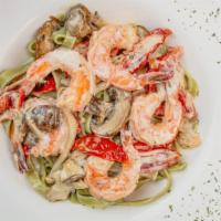 Shrimp Luisa · A delicious blend of mushrooms, roasted tomatoes, garlic, herbs and shrimp in a white wine c...