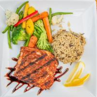 Blackened Salmon · Fresh salmon fillet with Cajun seasoning finished with a blackberry chipotle sauce. Served w...