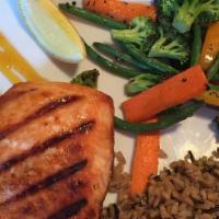 L'Orange Salmon · Fresh salmon fillet grilled to perfection, and finished with an orange honey glaze. Served w...