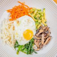 Bibimbap · Traditional Korean dish. 5 different seasonal vegetables with spicy Korean paste and a fried...
