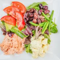 Salmon Nicoise · Chilled poached salmon, tomato, Kalamata olives green beans, and our house made country pota...