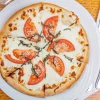Pizza Marguerite · Mozzarella and parmesan cheese, sliced tomatoes, and basil.