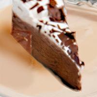 Chocolate Mousse Cake · Dark chocolate cookie crust and a layer of smooth chocolate mousse, topped with whipped topp...