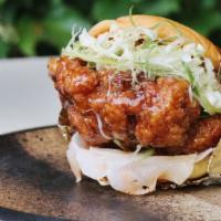 Korean Fried Chicken Sando · Double fried, boneless chicken thigh in sweet garlic soy glaze or chili oil dipped and duste...