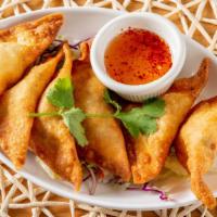 Crab Rangoon · Crisp wonton dumpling filled with cream cheese and crab. Served with our house-made sweet ch...