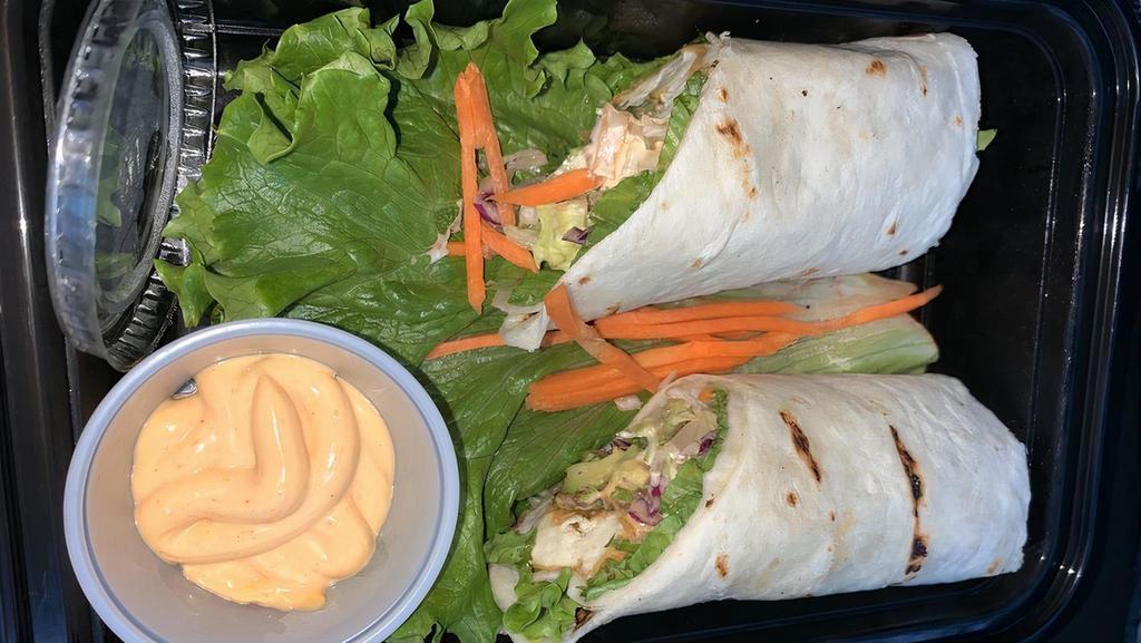 Saigon Wrap · Can be vegetarian or vegan. Grilled soy marinated chicken or tofu, avocado, cucumber, lettuce, sliced carrot, and sriracha aioli. Wrapped in a flour tortilla.