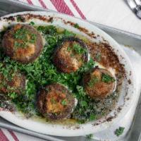 Seafood Stuffed Mushrooms · Mushrooms stuffed with shrimp, baked in garlic butter.