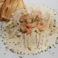 Shrimp Alfredo · Fresh shrimp sautéed in garlic butter, tossed in a house-made Alfredo sauce, and poured over...