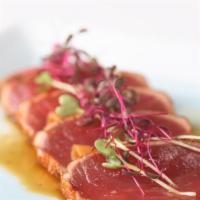 Tuna Tataki  · Seared tuna, Japanese pepper flake, scallions, served w. radish & ponzu sauce