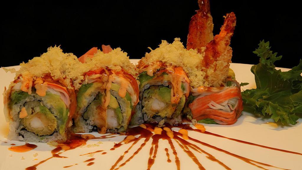 Angel Wings Roll  · Golden shrimp tempura, cucumber & avocado, topped with crab, spicy mayo and eel sauce & tempura flake
