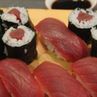 Tuna Sushi · 8 pieces of raw tuna on seasoned rice and one tuna roll