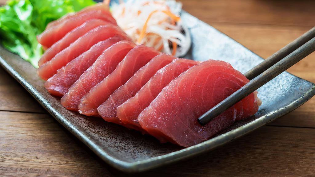 Tuna Sashimi · 14 pieces of raw tuna  and a bowl of seasoning sushi rice