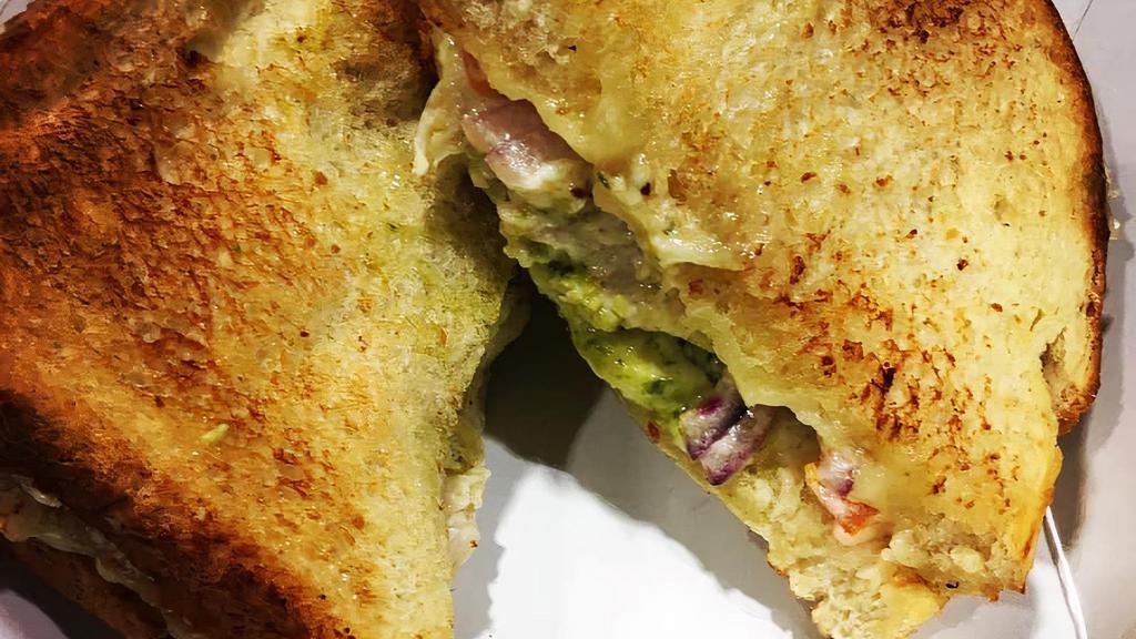 Turkey Pesto Melt · Hot oven roasted turkey, havarti cheese, tomato, red onion, pesto, & mayo. Served on toasted sourdough bread.  Comes with chips. Chip selection varies. Please select top 2 choices, however we may need to make substitutions!