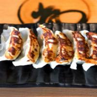 A3 Gyoza · Pan-fried pork and chicken pot stickers.