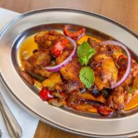 Chicken Tandoori Wings · Gluten free. Tandoori oven roasted chicken wings covered in our house hot sauce. House favor...