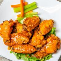 Giant Chicken Wings · House favorite! A pound of our perfectly seasoned XL wings served with your choice of Sinroc...