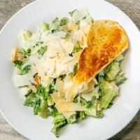 Classic Caesar Salad · Fresh romaine tossed in creamy Caesar dressing, garlic croutons and shaved parmesan.