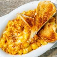 Sinfully Good Mac & Cheese · The bomb! Shell pasta drenched in our creamy rich Tillamook sharp cheddar sauce and topped w...