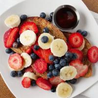 Orange Custard Dipped French Toast · 2 pcs of whole grain bread, seasonal berries, bananas and 100% pure maple syrup / add bacon,...