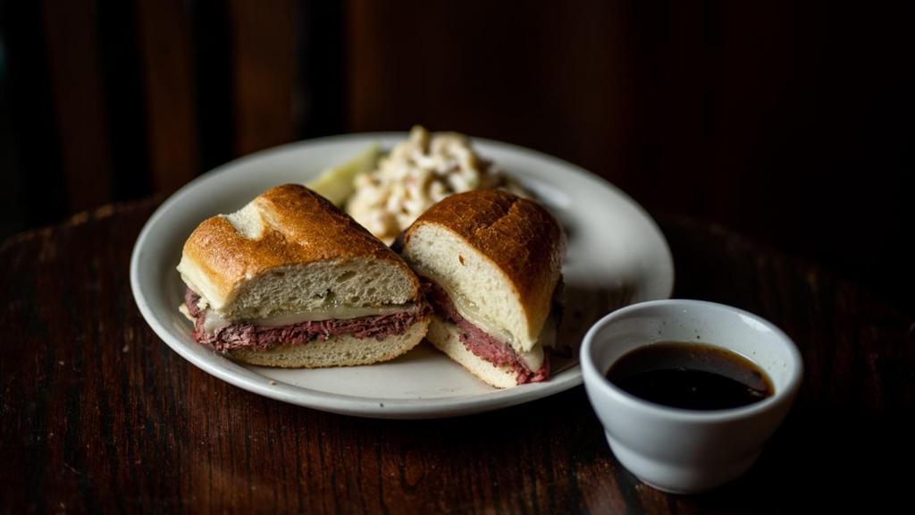French Dip · garlic & herb roasted beef, provolone & mayo on a grinder roll, served with au jus