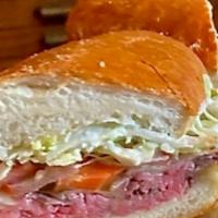 Italian Beef · garlic & herb roasted beef, swiss cheese, giardiniera (chicago-style pickled peppers), tomat...