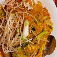 Pad Woon Sen · Stir-fried grass noodles, egg, onion, tomatoes, carrots, celery, and cabbage with special sa...
