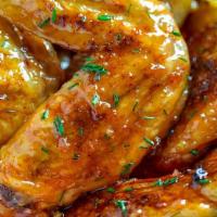 Honey Garlic Wings · Delicious wings tossed in a sweet honey garlic sauce.