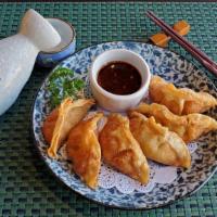 Chicken Gyoza ( 6 Pieces ) · 6 Piece of Japanese fried dumplings with chicken and vegetables. Served with Japanese chili ...