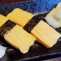 Tamago / Sweet Egg · 2 piece of Sweet egg nigiri. Fully cooked.